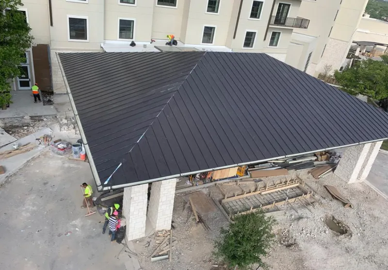 Metal roofing installation team working on a commercial building in Centralia
